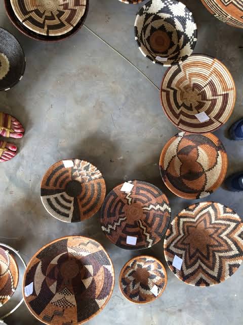 Women of Rubona weaving traditional baskets from natural fibers